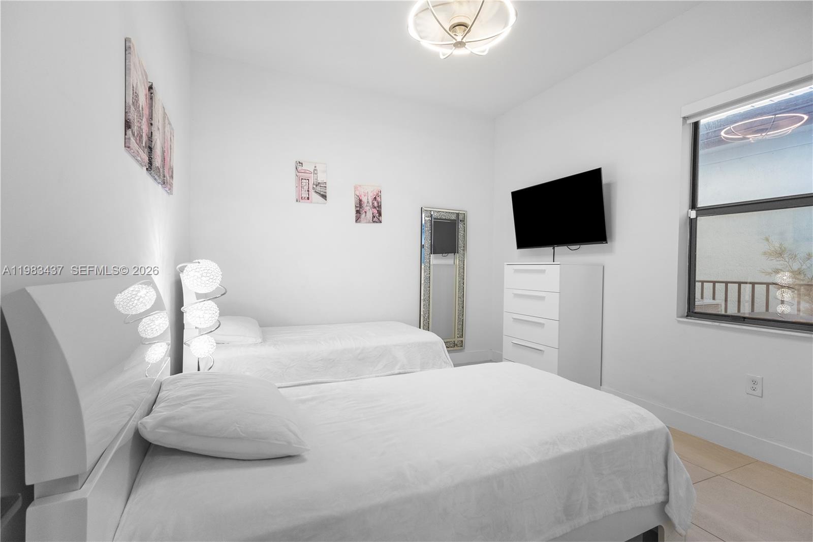 4335 Southwest 174th Avenue Miramar, FL 33029 - Photo 33 of 58 a bedroom with a bed and a flat screen tv