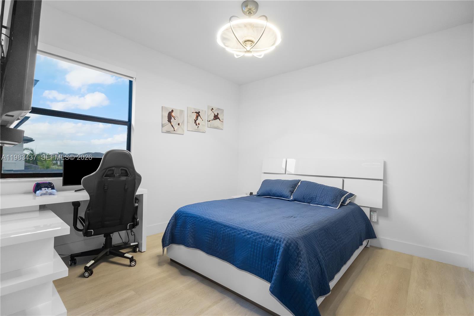 4335 Southwest 174th Avenue Miramar, FL 33029 - Photo 35 of 58 a bedroom with a bed and a chair