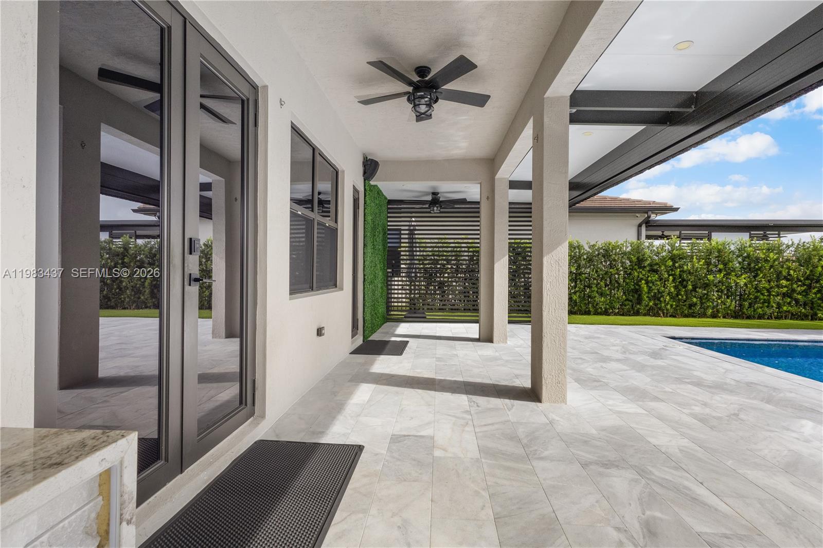 4335 Southwest 174th Avenue Miramar, FL 33029 - Photo 39 of 58 a view of an entryway with a floor to ceiling window