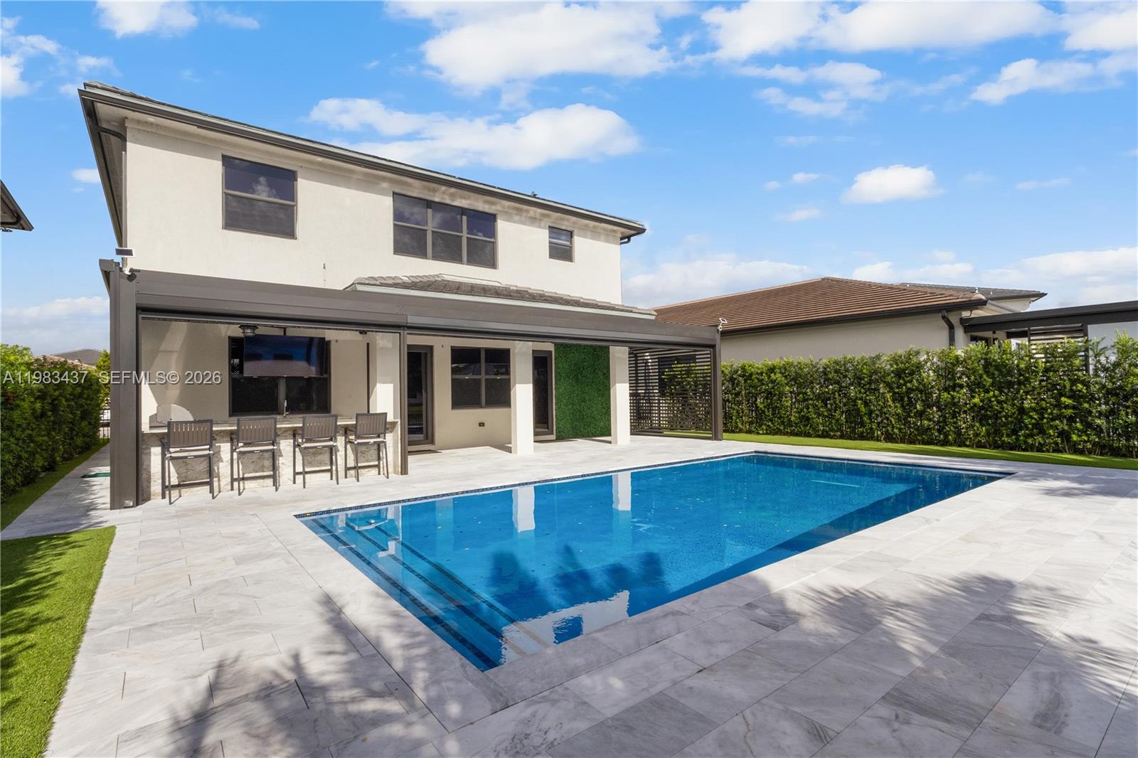 4335 Southwest 174th Avenue Miramar, FL 33029 - Photo 42 of 58 a view of a house with swimming pool and sitting area