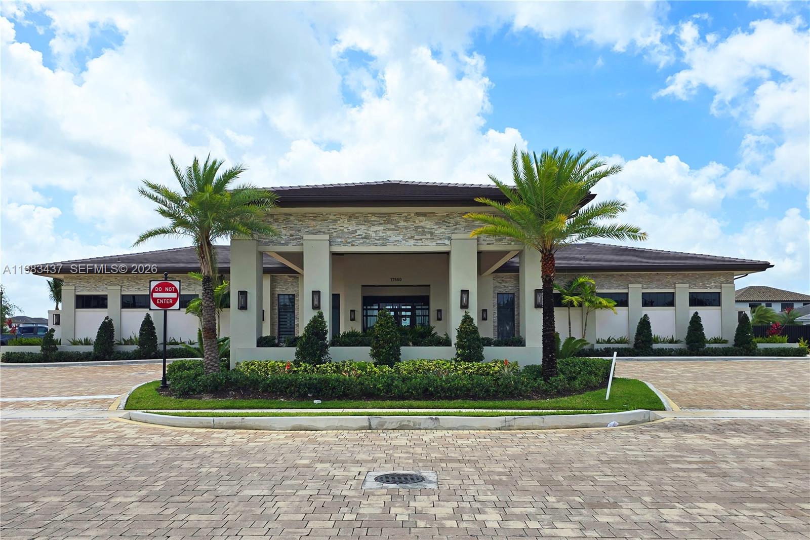 4335 Southwest 174th Avenue Miramar, FL 33029 - Photo 44 of 58 a front view of a house with a yard and potted plants