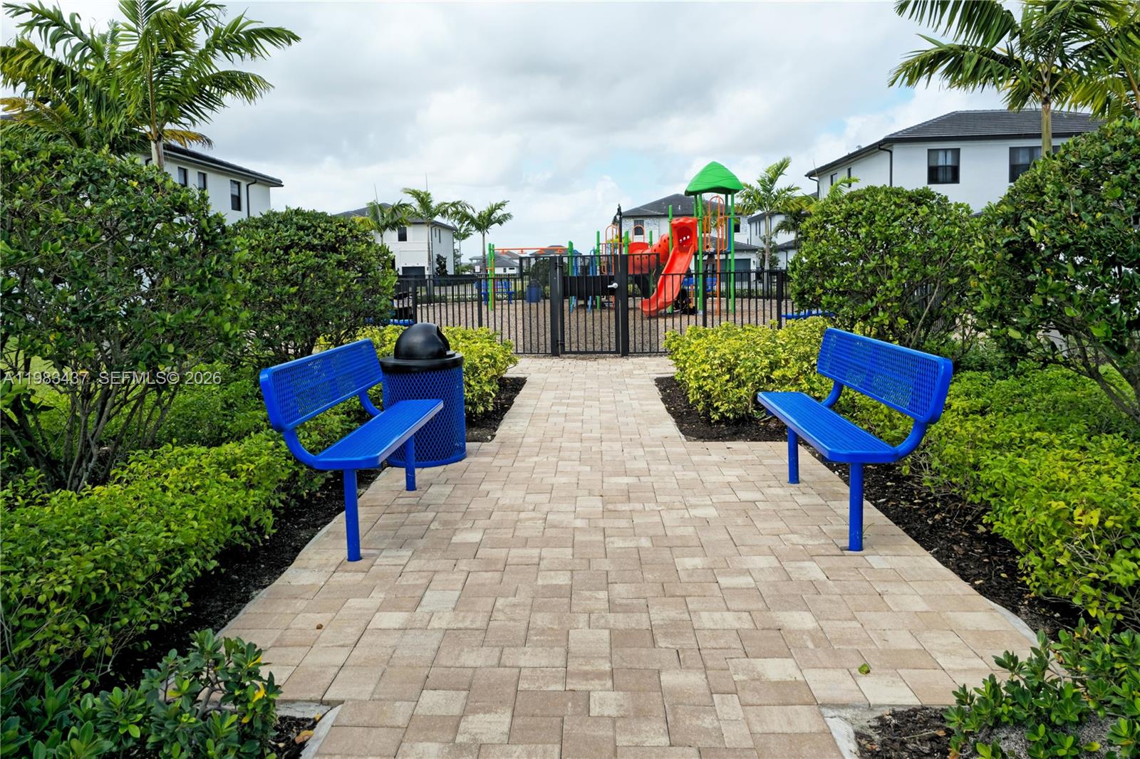 4335 Southwest 174th Avenue Miramar, FL 33029 - Photo 47 of 58 a view of street with seating area and trees in the background