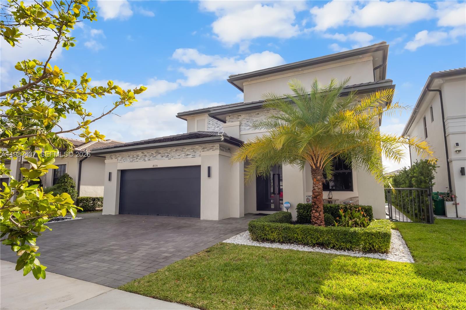 4335 Southwest 174th Avenue Miramar, FL 33029 - Photo 58 of 58 a view of a house with a yard and plants