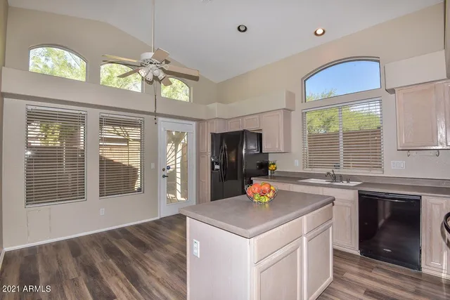 a kitchen with a sink a counter space and stainless steel appliances