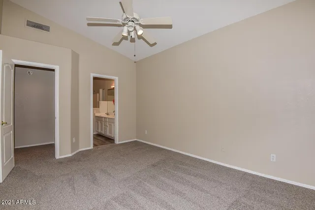 a view of empty room with fan