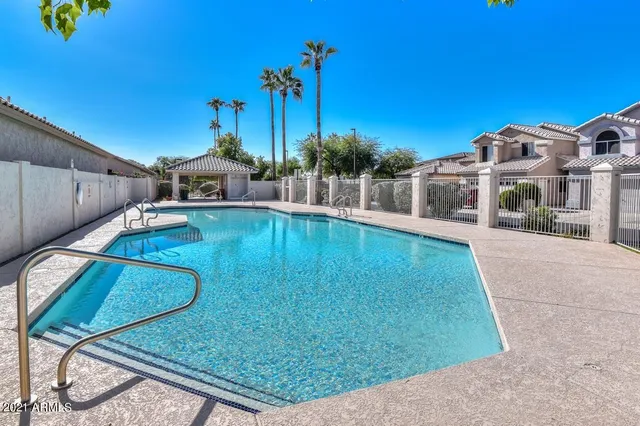 a view of a swimming pool with a patio