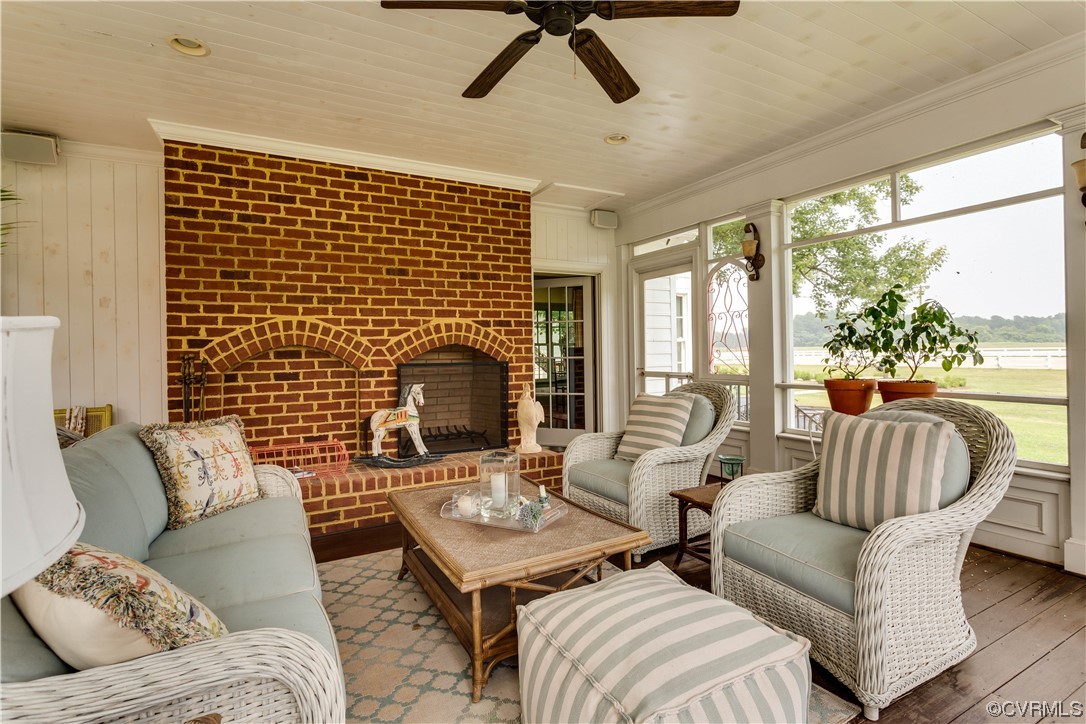 1248 Hobbs Mill Road Wilsons, VA 23894 - Photo 22 of 50 a living room with couches a coffee table and a fireplace with a flat tv screen