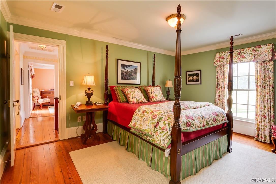 1248 Hobbs Mill Road Wilsons, VA 23894 - Photo 25 of 50 a bedroom with a bed and a dresser next to a window