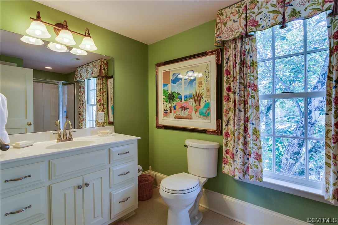 1248 Hobbs Mill Road Wilsons, VA 23894 - Photo 26 of 50 a bathroom with a toilet sink and mirror