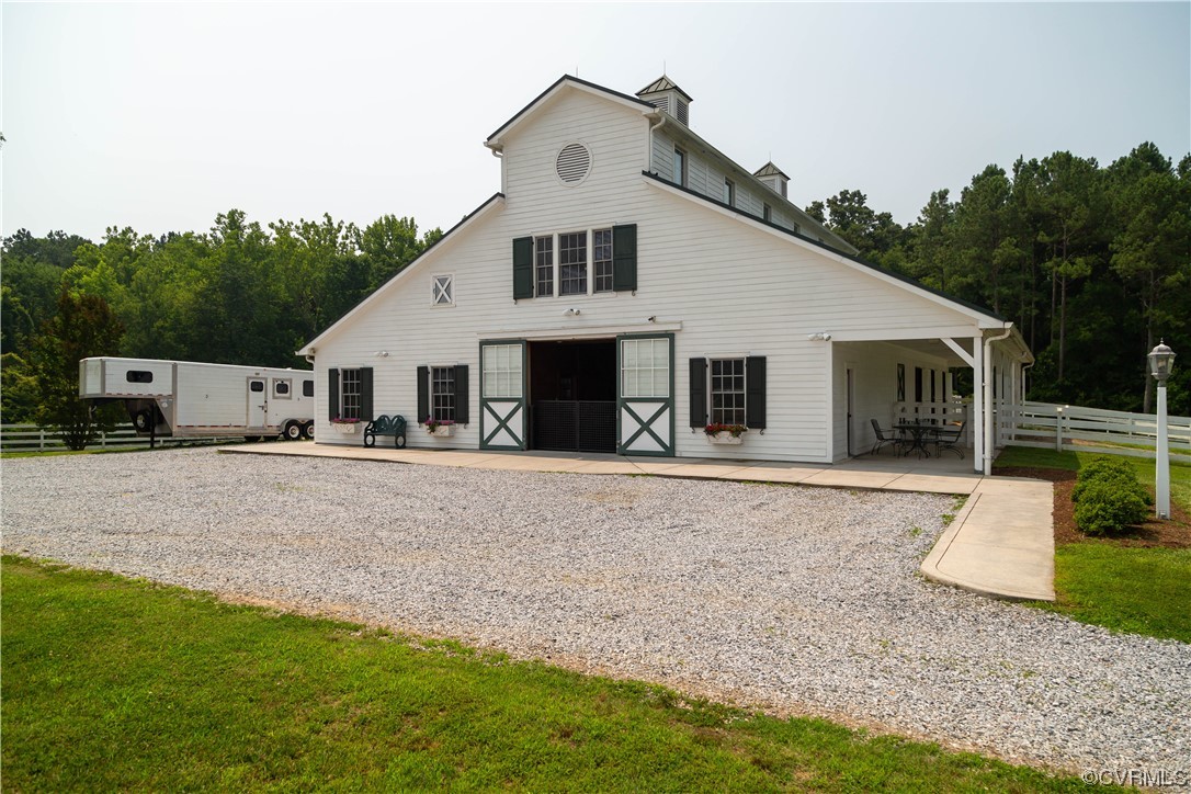 1248 Hobbs Mill Road Wilsons, VA 23894 - Photo 35 of 50 a front view of a house with a yard and garage