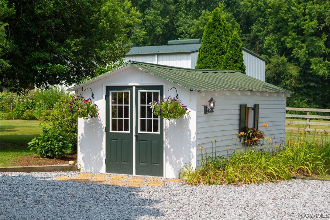 1248 Hobbs Mill Road Wilsons, VA 23894 - Photo 43 of 50 a front view of a house with garden