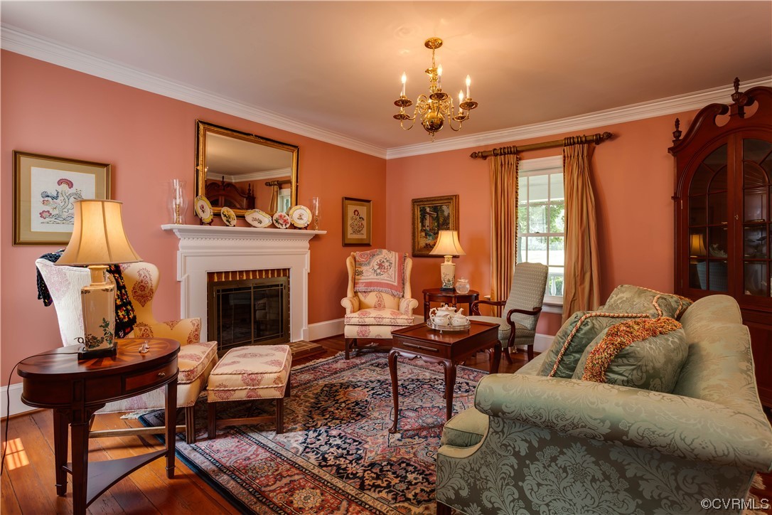 1248 Hobbs Mill Road Wilsons, VA 23894 - Photo 8 of 50 a living room with furniture a chandelier and a fireplace