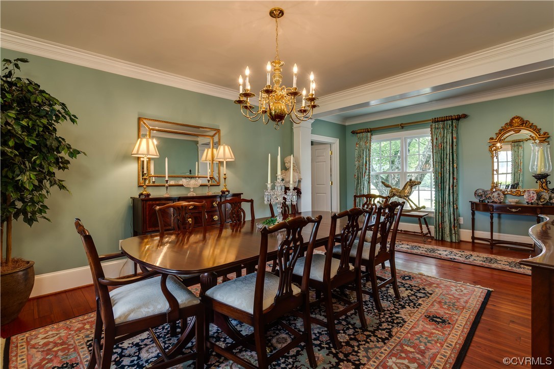 1248 Hobbs Mill Road Wilsons, VA 23894 - Photo 10 of 50 a view of a dining room with furniture a chandelier and wooden floor