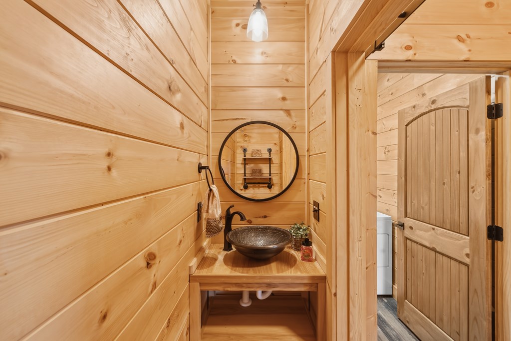 102 High Mdws Trail Morganton, GA 30560 - Photo 11 of 45 a bathroom with a sink a toilet and a shower