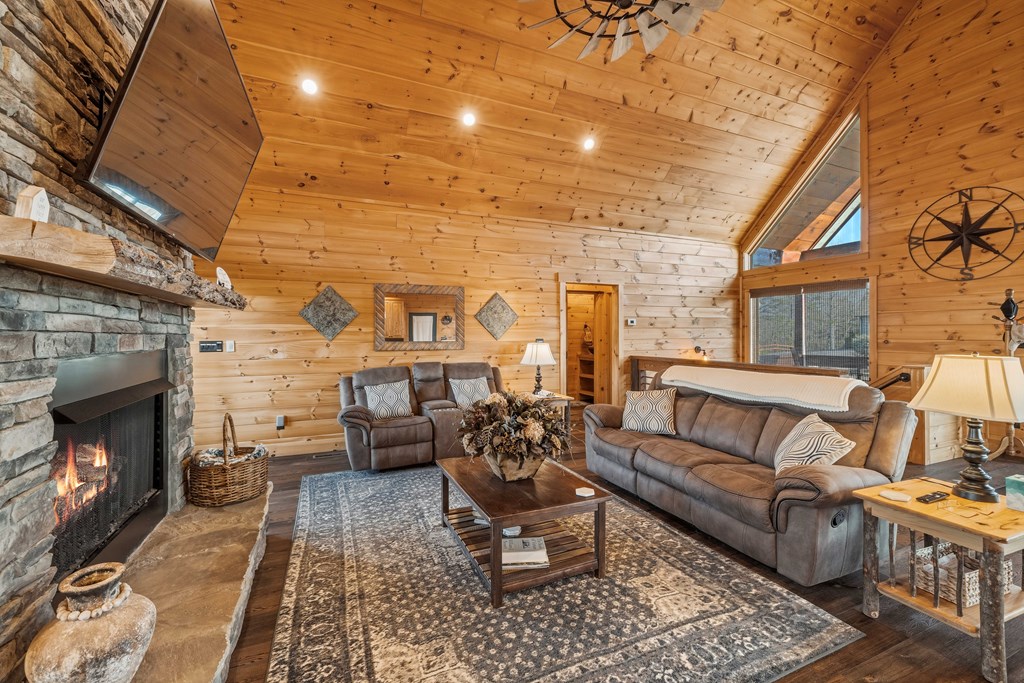 102 High Mdws Trail Morganton, GA 30560 - Photo 13 of 45 a living room with furniture a fireplace and a table