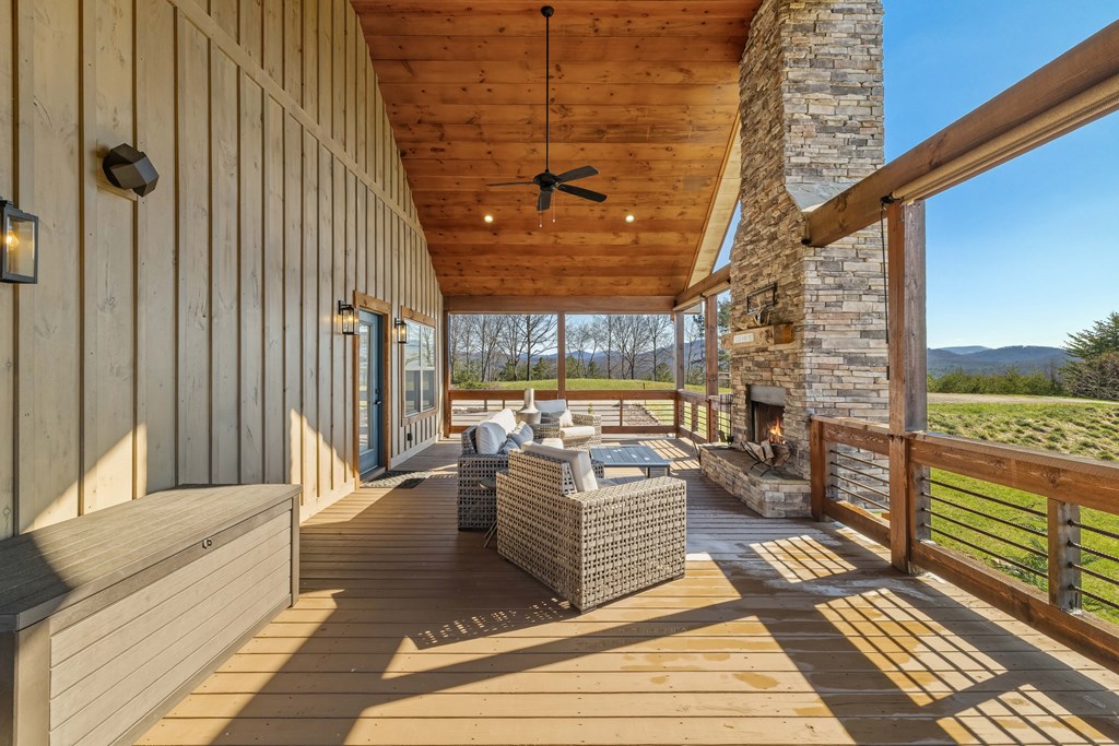 102 High Mdws Trail Morganton, GA 30560 - Photo 20 of 45 a balcony with couch and wooden floor