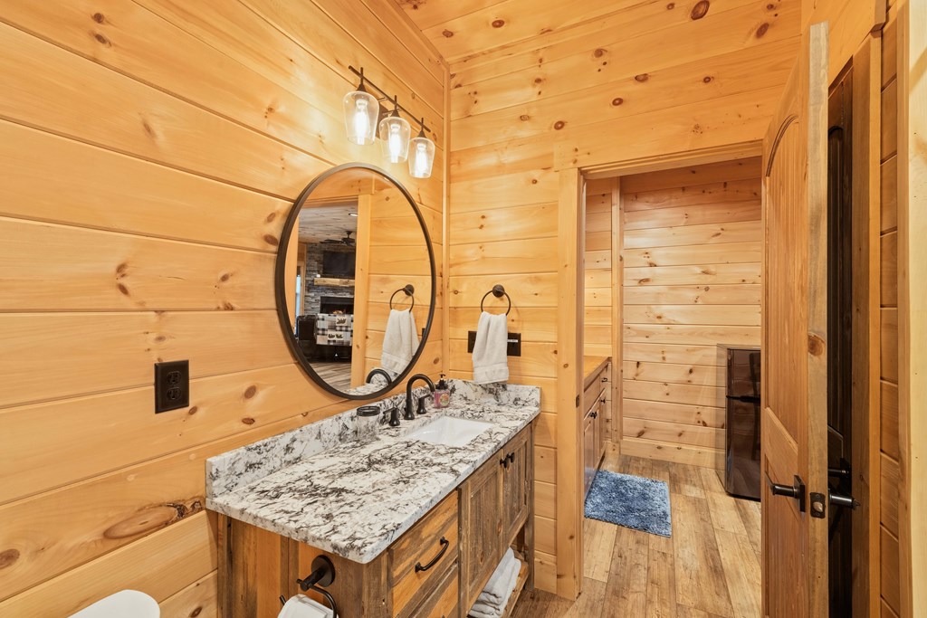 102 High Mdws Trail Morganton, GA 30560 - Photo 30 of 45 a bathroom with a sink a mirror and a shower