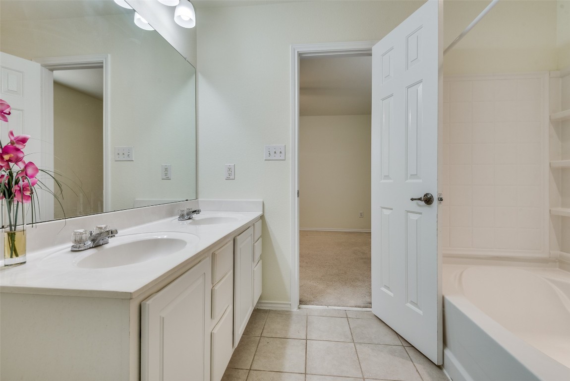 5701 Viewpoint Drive Austin, TX 78744 - Photo 17 of 25 a bathroom with a sink and a mirror