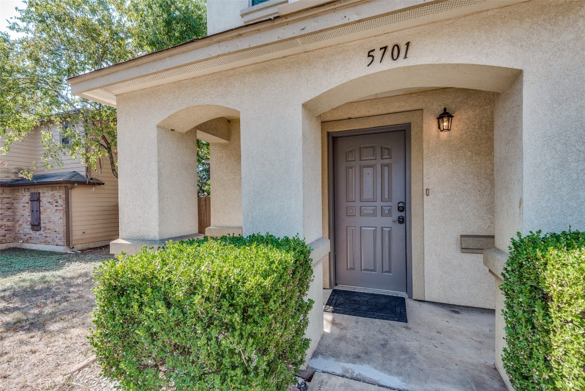 5701 Viewpoint Drive Austin, TX 78744 - Photo 4 of 25 a front view of a house with garden
