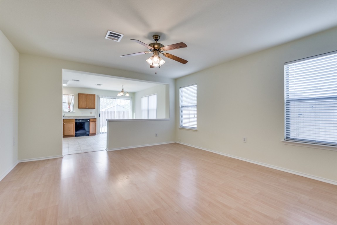5701 Viewpoint Drive Austin, TX 78744 - Photo 8 of 25 a view of empty room with wooden floor and fan