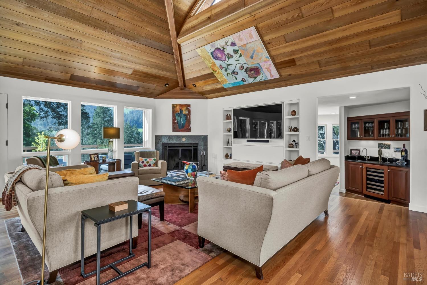 511 Kortum Canyon Road Calistoga, CA 94515 - Photo 4 of 87 Living room with soaring ceiling, wood burning fireplace, entertaining wall and wet bar.