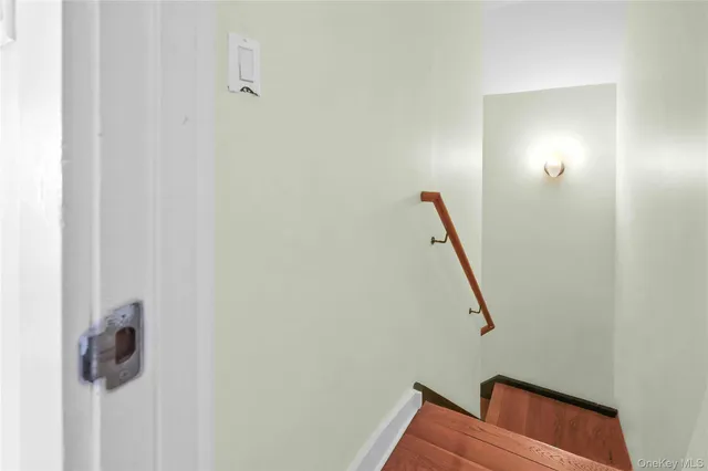 a view of staircase with white walls