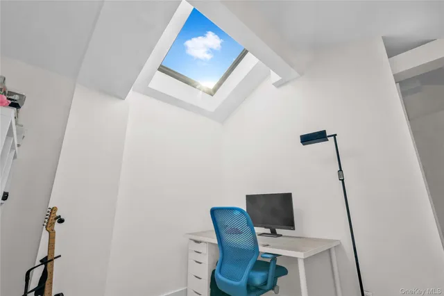 a view of workspace with wooden floor windows