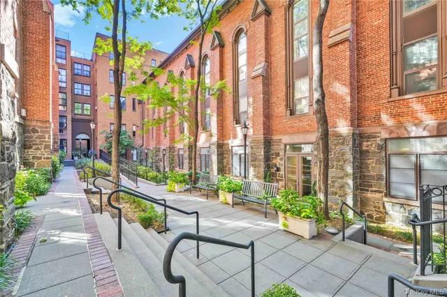 a swimming pool with outdoor seating and yard