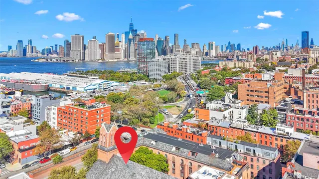 a view of a brick house with a large windows