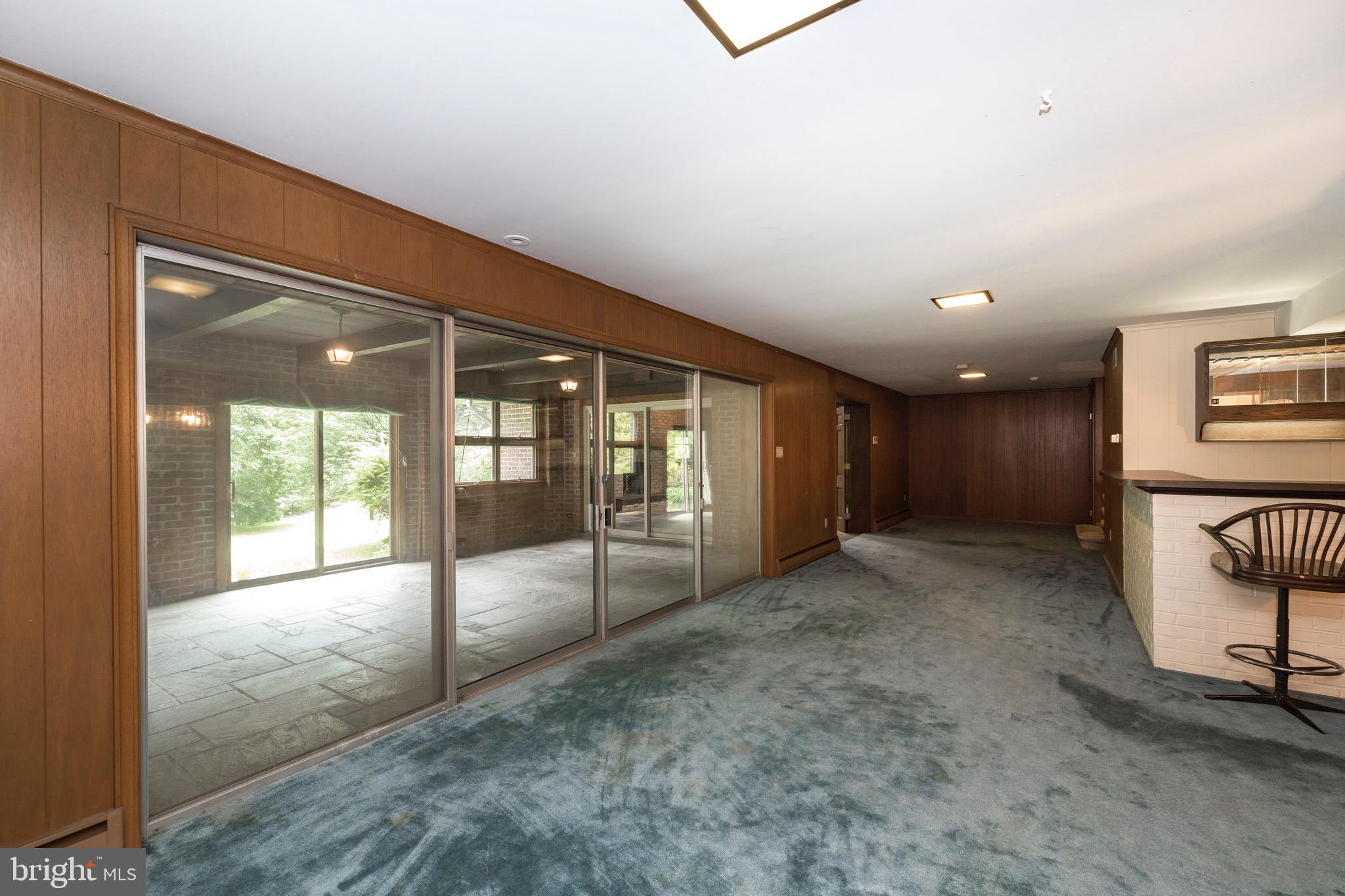 201 North Tulpehocken Road Reading, PA 19601 - Photo 20 of 29 Sliding glass doors to a multi season room