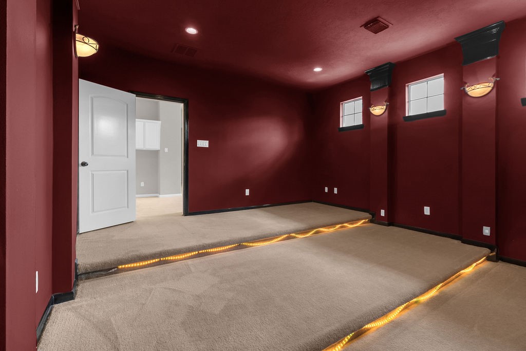 7306 Starflower Katy, TX 77494 - Photo 48 of 50 a view of an empty room with windows and ceiling fan