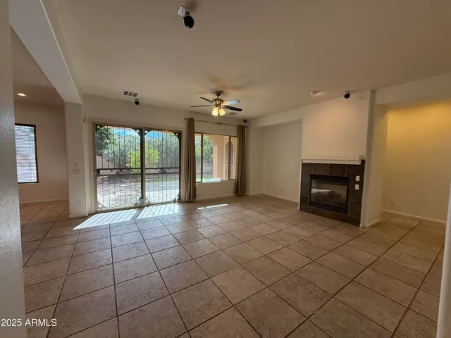 a view of workspace with window and ceiling fan