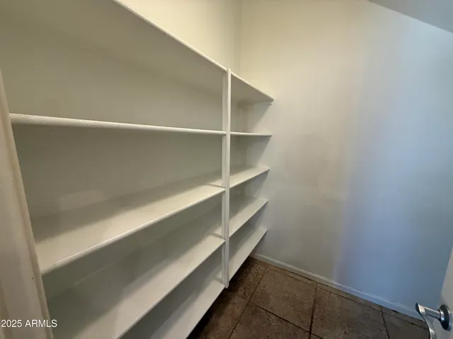 a bathroom with a sink a mirror and shower