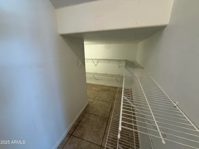 a view of a balcony with furniture