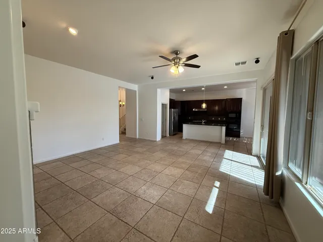 a bathroom with a granite countertop sink a toilet a mirror and shower