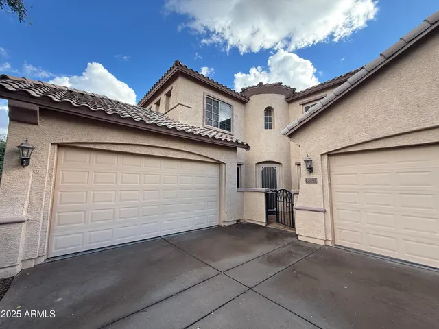 a view of a house with a garage