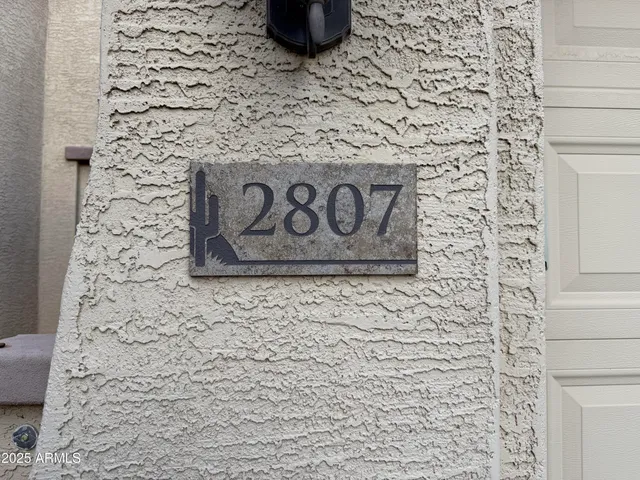 a view of an empty room and a ceiling fan