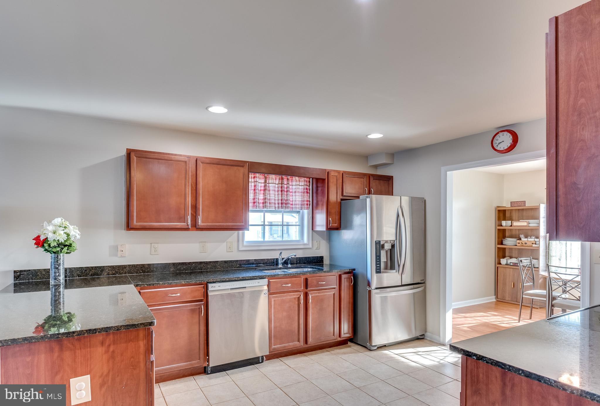 4 Fuzzy Tail Drive Ranson, WV 25438 - Photo 6 of 38 Kitchen with Granite, Stainless and Ceramic Tile