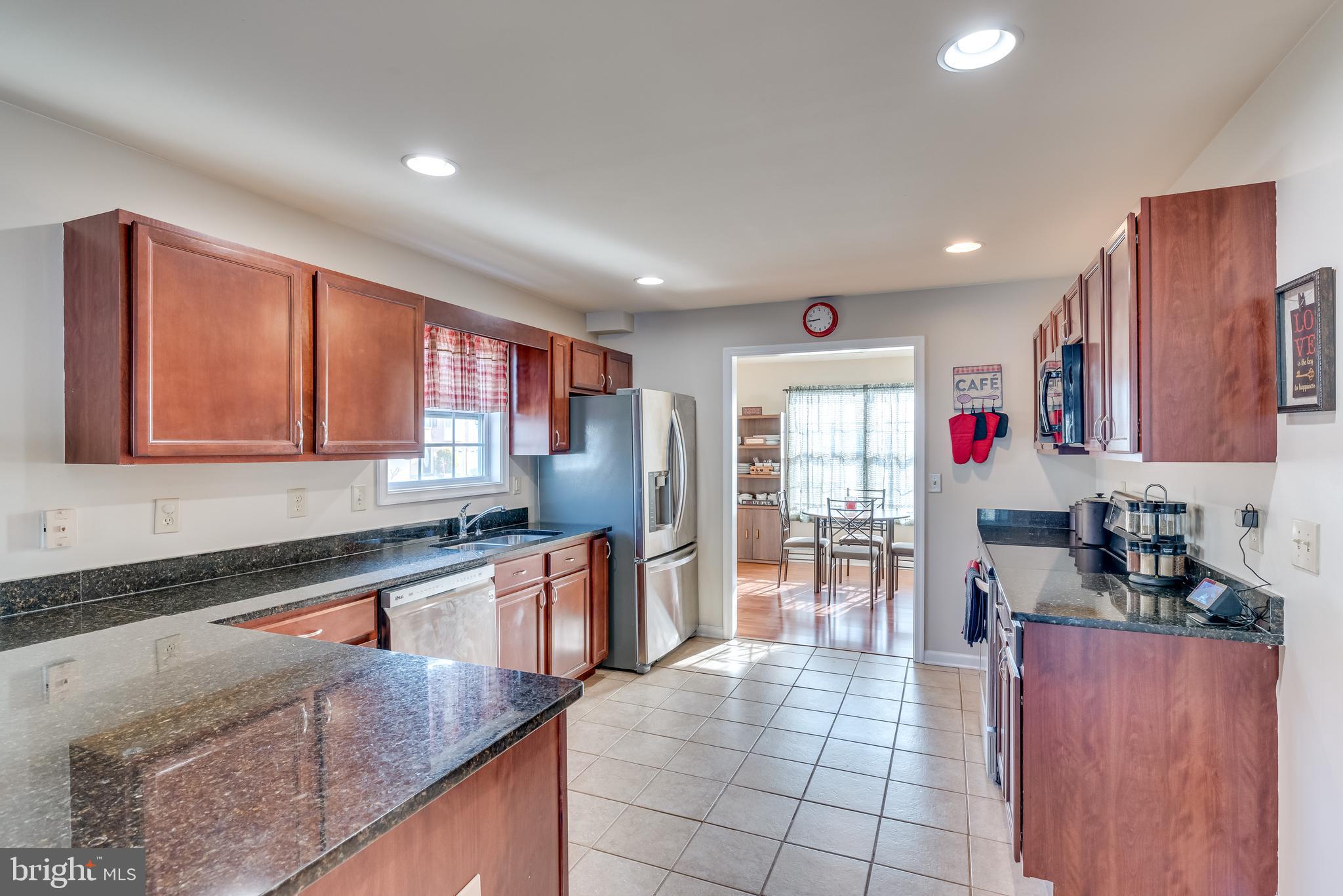 4 Fuzzy Tail Drive Ranson, WV 25438 - Photo 7 of 38 Kitchen with Granite, Stainless and Ceramic Tile