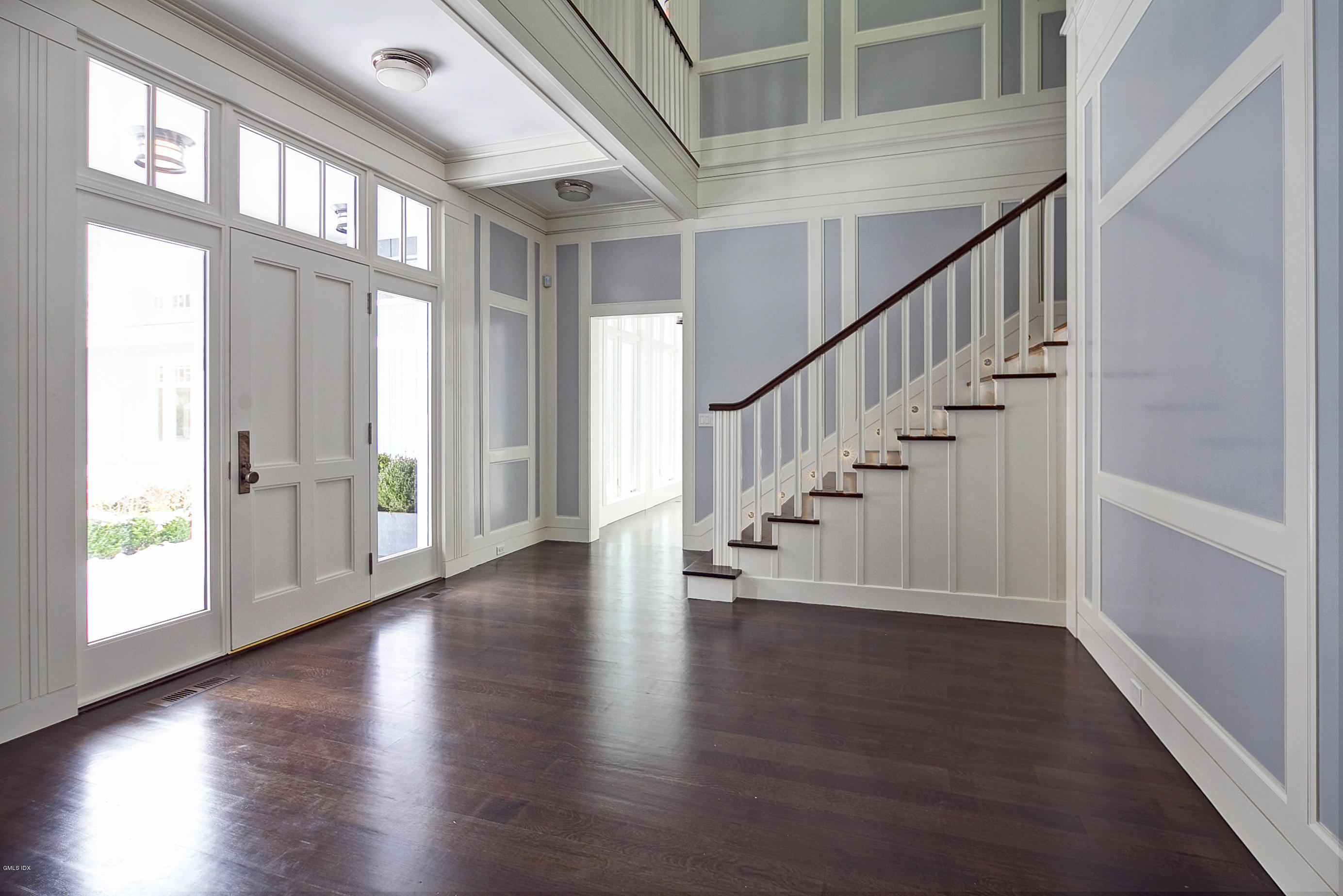 2 Wooddale Road Greenwich, CT 06830 - Photo 3 of 36 a view of an entryway with wooden floor