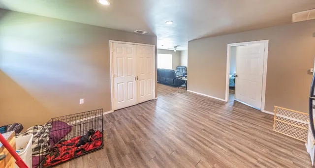 a very nice looking room with wooden floor