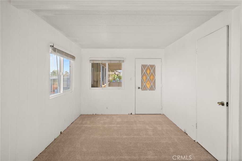 1255 Amethyst Street, Unit 32 Mentone, CA 92359 - Photo 11 of 32 an empty room with windows