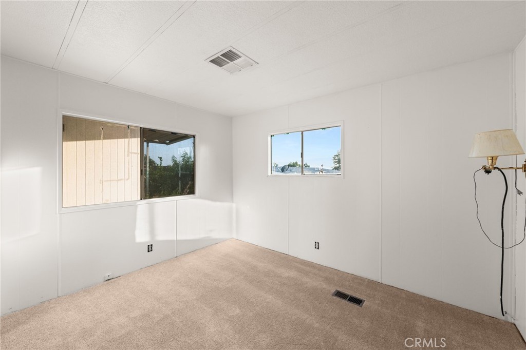 1255 Amethyst Street, Unit 32 Mentone, CA 92359 - Photo 18 of 32 a view of a room that has a window