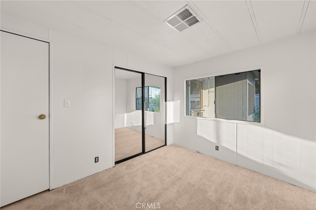 1255 Amethyst Street, Unit 32 Mentone, CA 92359 - Photo 19 of 32 a view of an empty room with window