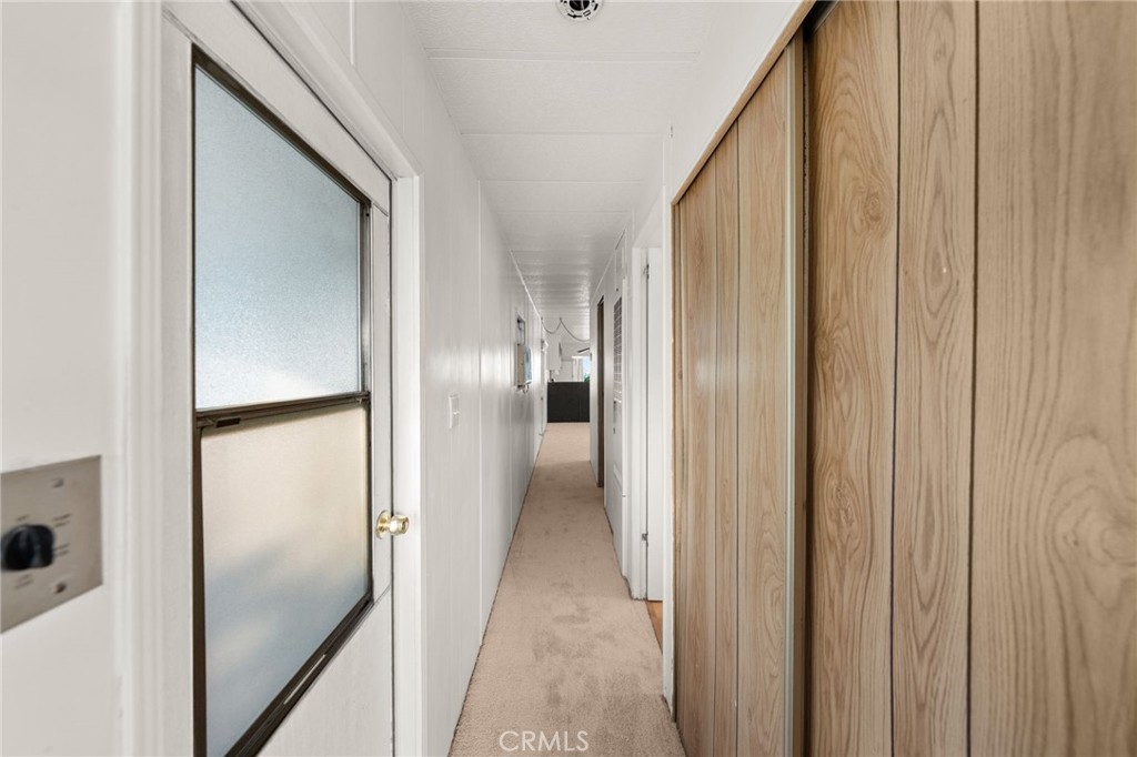 1255 Amethyst Street, Unit 32 Mentone, CA 92359 - Photo 20 of 32 a view of a hallway