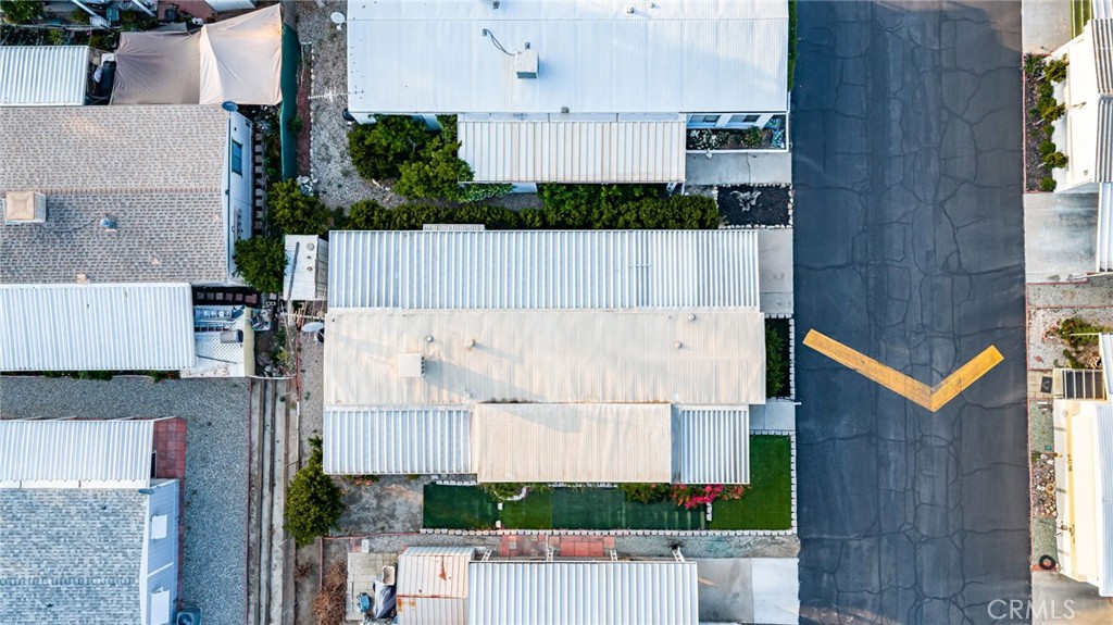 1255 Amethyst Street, Unit 32 Mentone, CA 92359 - Photo 26 of 32 aerial view of a house with a garden and stairs