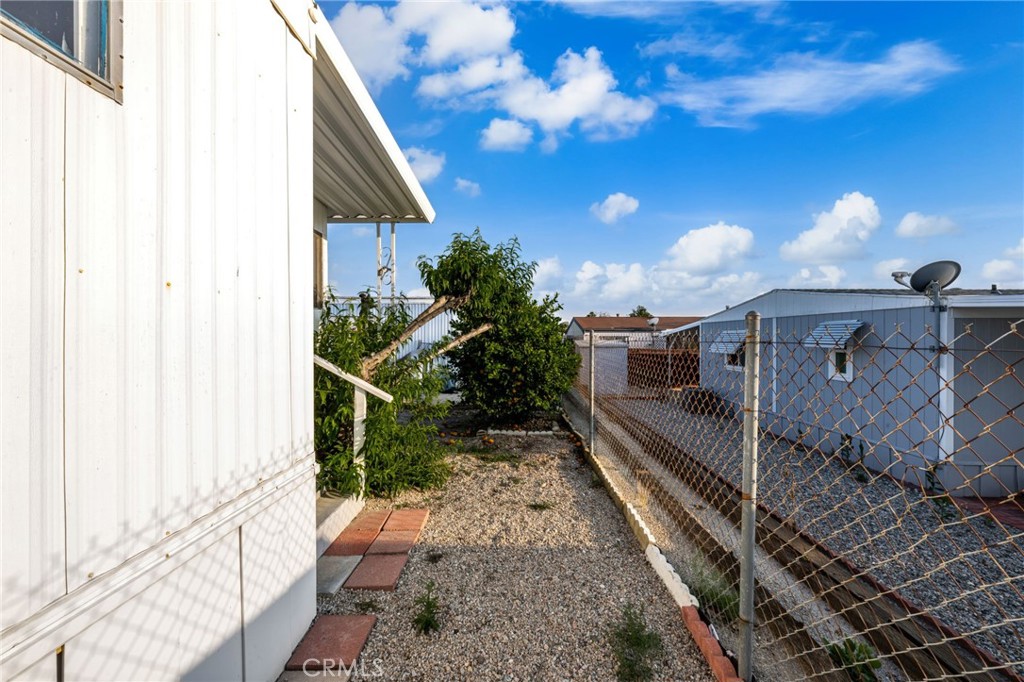 1255 Amethyst Street, Unit 32 Mentone, CA 92359 - Photo 30 of 32 a view of a back yard of the house