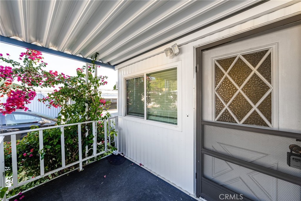 1255 Amethyst Street, Unit 32 Mentone, CA 92359 - Photo 4 of 32 a view of porch with wooden stairs and stairs