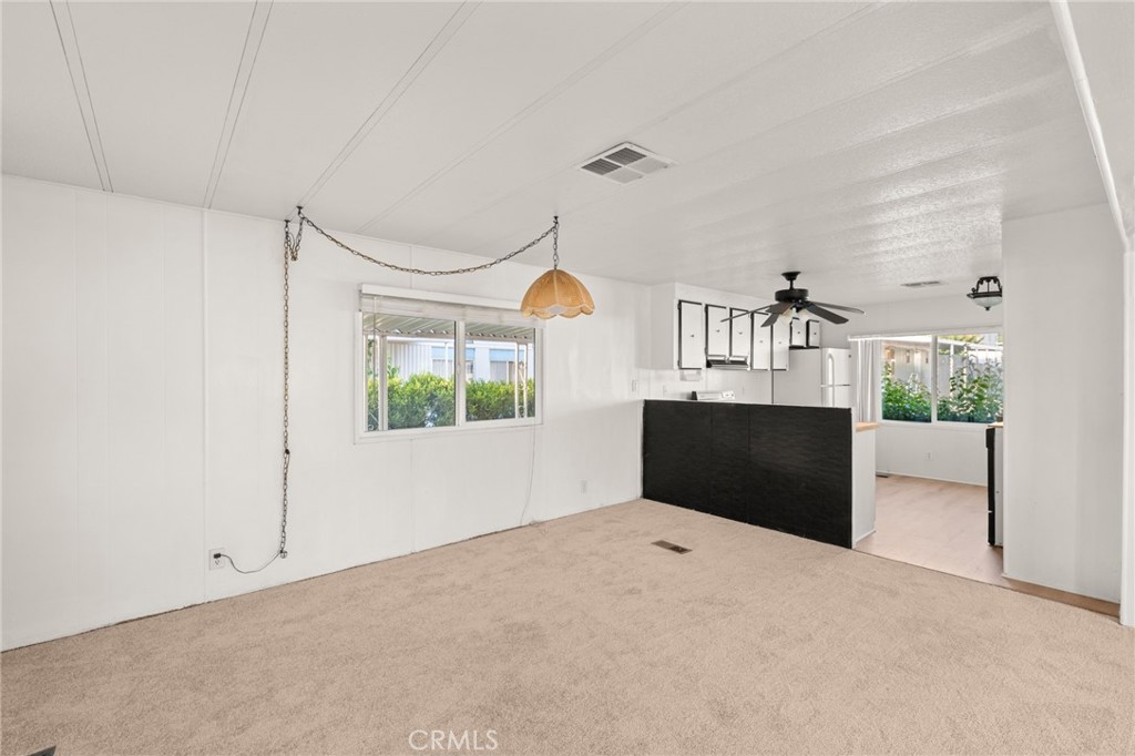 1255 Amethyst Street, Unit 32 Mentone, CA 92359 - Photo 9 of 32 a bedroom with a bed and a large window