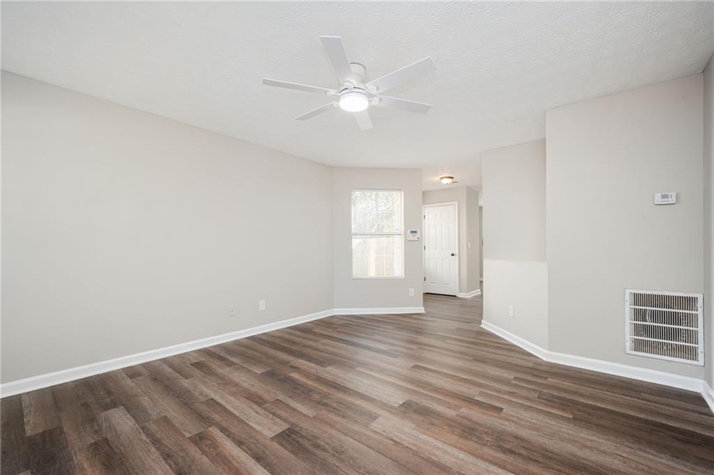 3375 River Run Trail Decatur, GA 30034 - Photo 12 of 27 a view of an empty room with wooden floor and a window